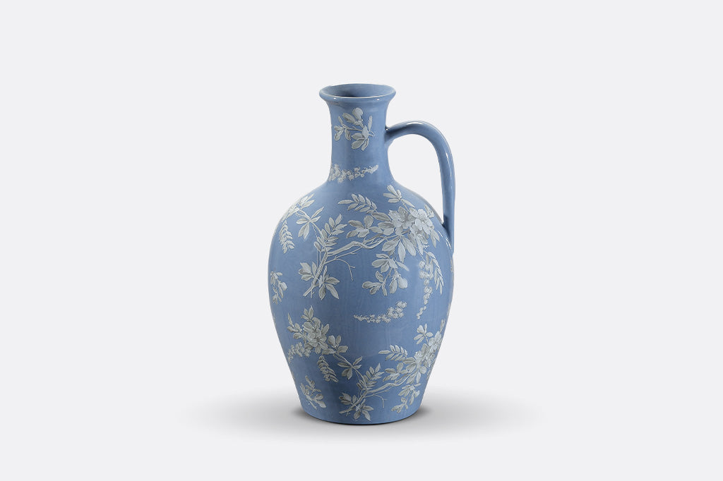 A blue jug ewer a white cornflower design.
