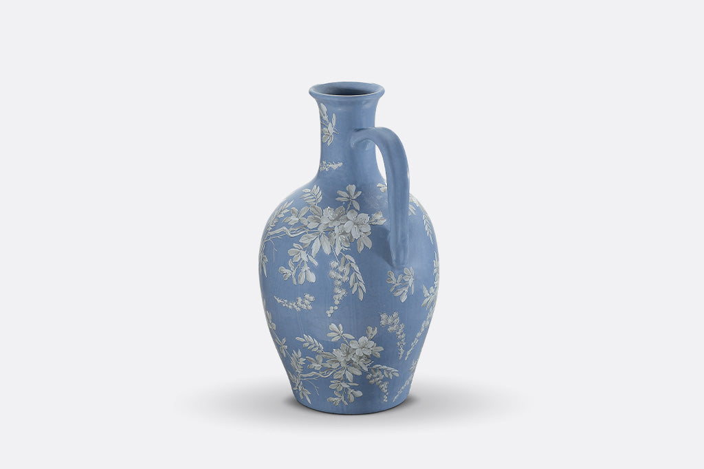 A blue jug ewer a white cornflower design.