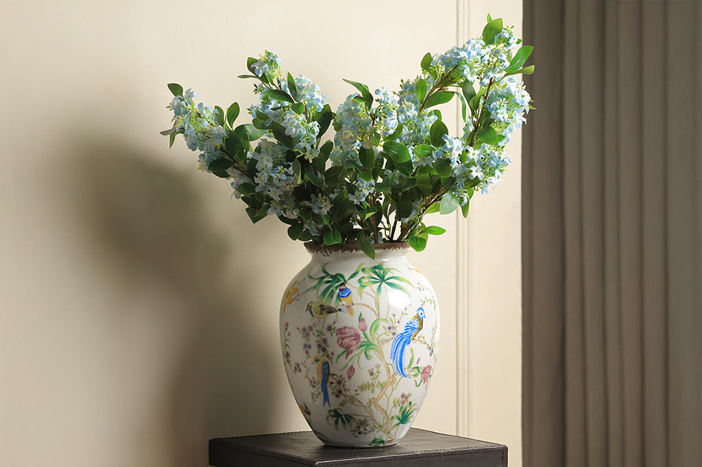 Decorative vase with floral and bird patterns