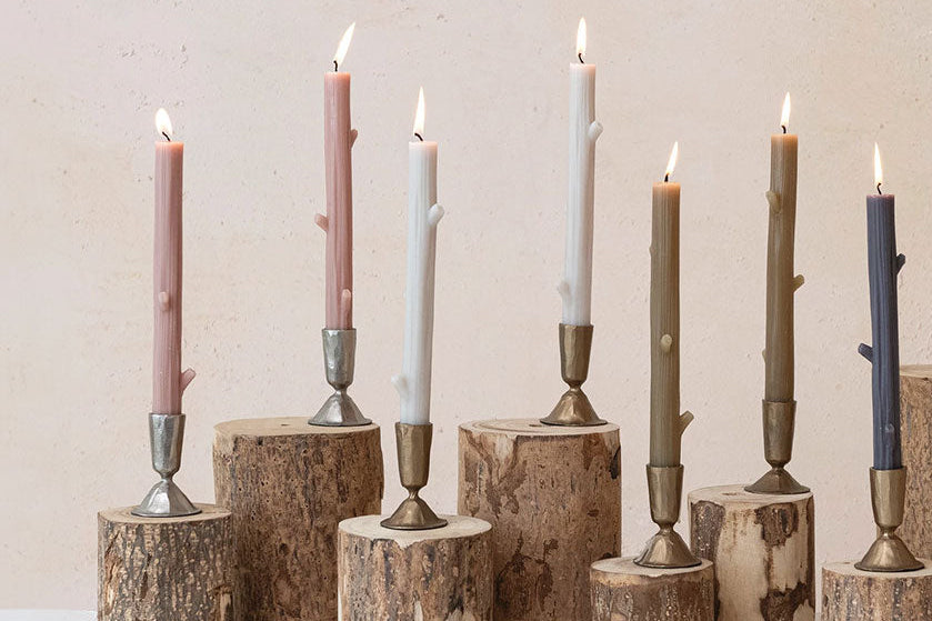 mauve blush taupe twig taper candles staged with white, brown, and blue colorways