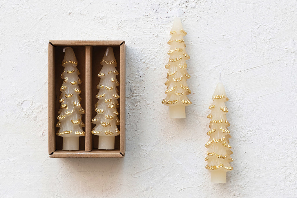 tree shaped taper candles in cream color with gold trimming on edges 