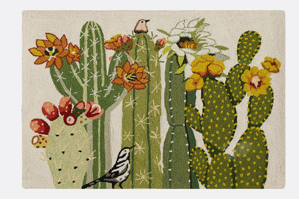 Hooked wool rug with assortment of blooming cacti, and bird