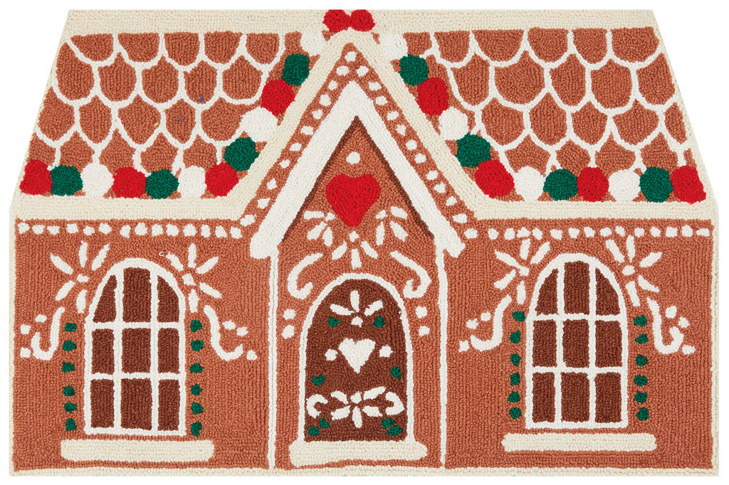 Hooked rug in shape of gingerbread cookie house with icing and gumdrop motif