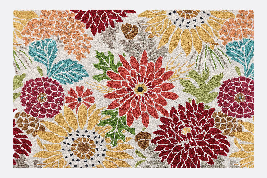 hooked rug with dahlia print, wool, in mult-colors of orange, blue and yellow