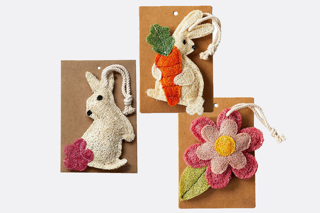 Compostable loofah dish scrubbies, featuring two bunnies and a pink flower