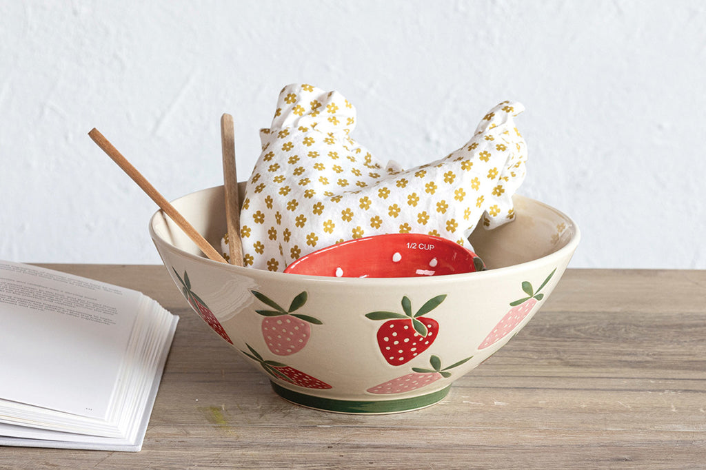 Strawberry stoneware bowl set on kitchen counter 