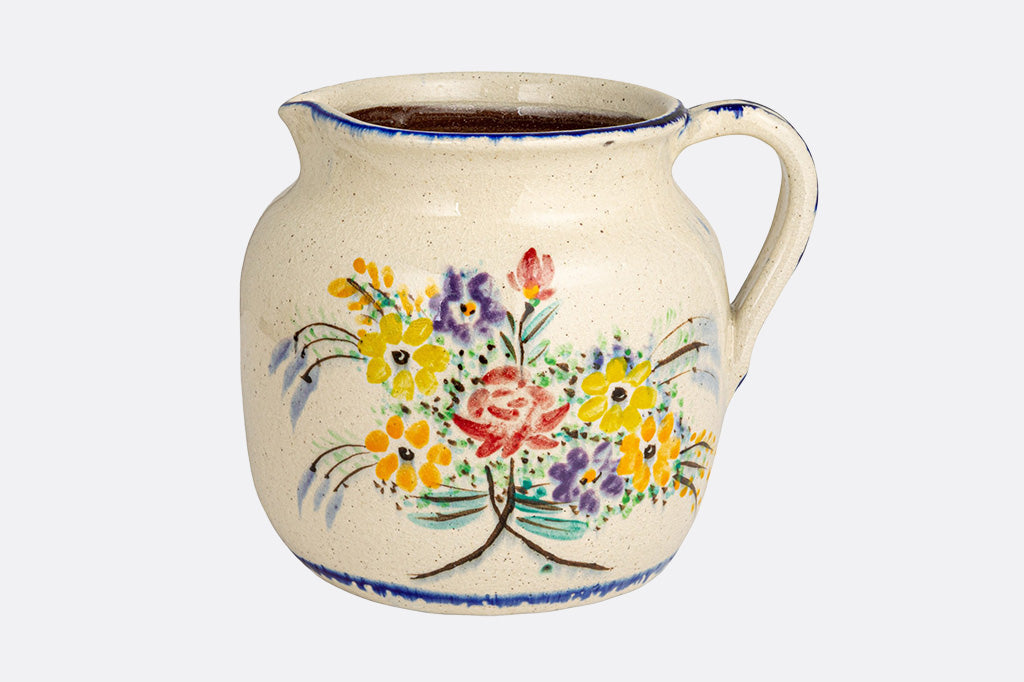 stoneware full size pitcher with glaze painted floral bouquet design