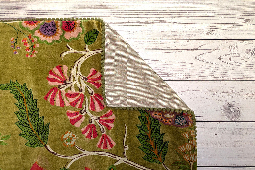 A close up of the edge of a pillow folded over to reveal it's textured backing.