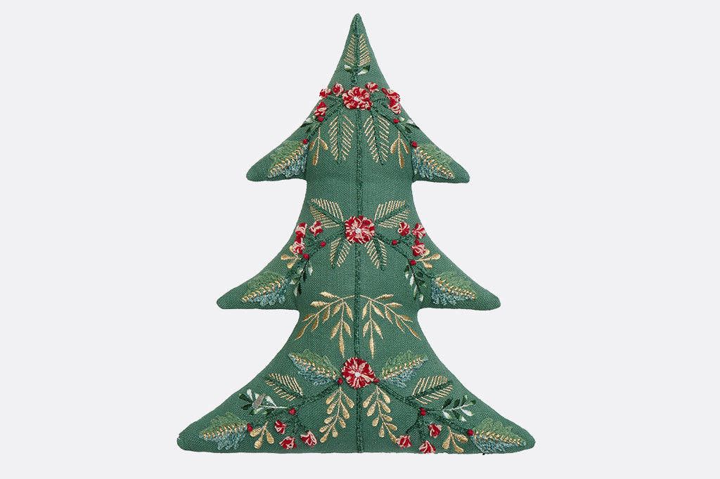 Decorative Christmas tree-shaped pillow with floral patterns on a white background
