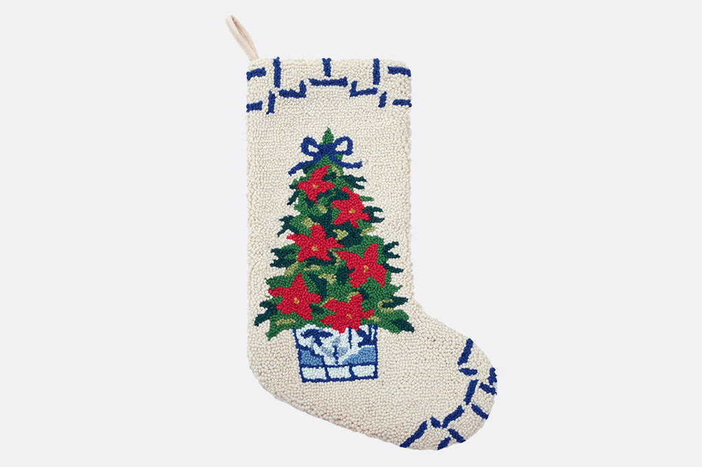 Decorative Christmas stocking with a tree design on a white background