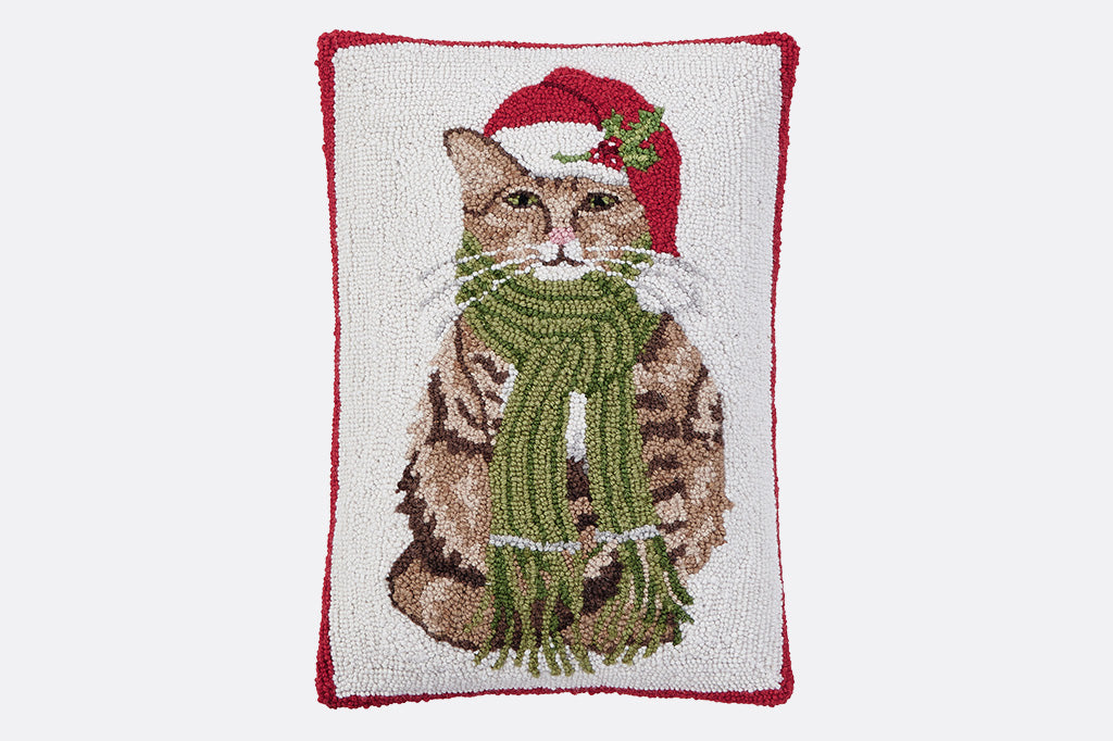 Vertical oriented throw pillow in hooked wool - shows a tabby cat in santa hat