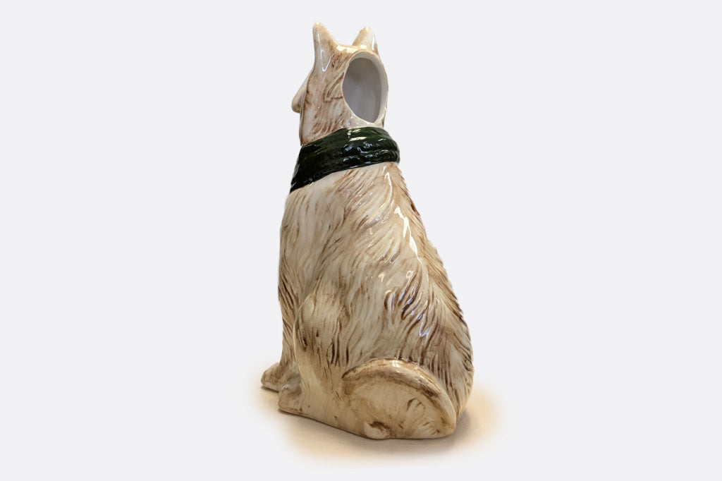 Dog-shaped vase with a green scarf. View shows opening to bud base