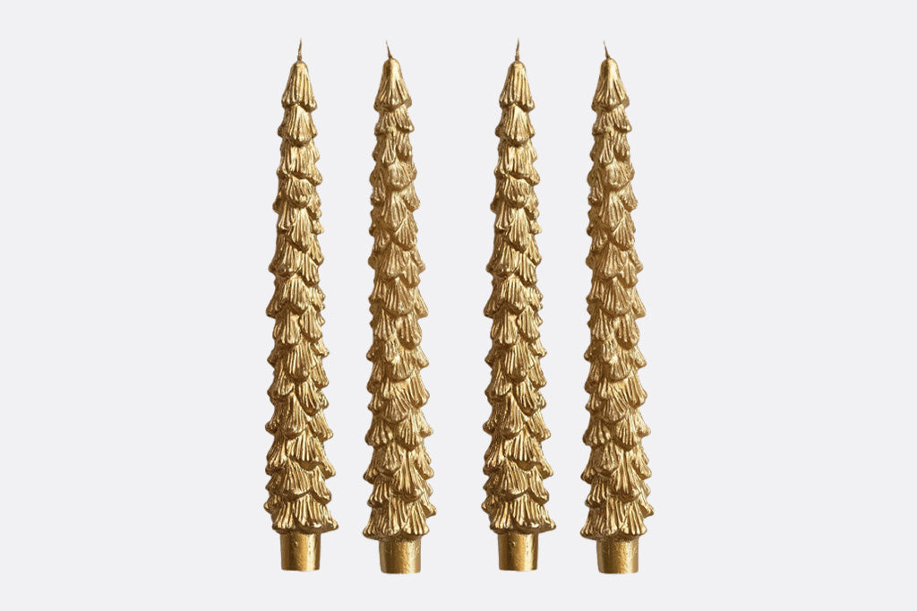4 gold taper candles molded to look like tall fir trees