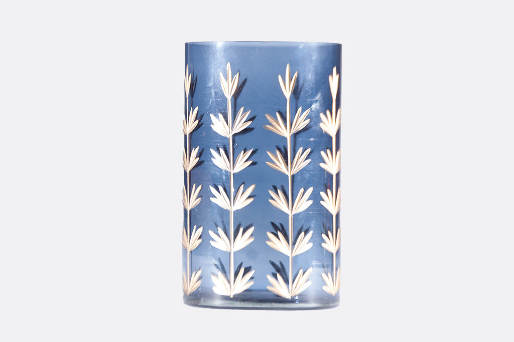 Blue glass vase with gilded details along the sides.