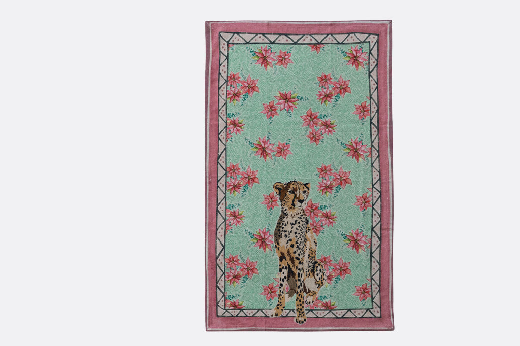 Holiday tea towel with animal illustrations and festive prints. Cheetah