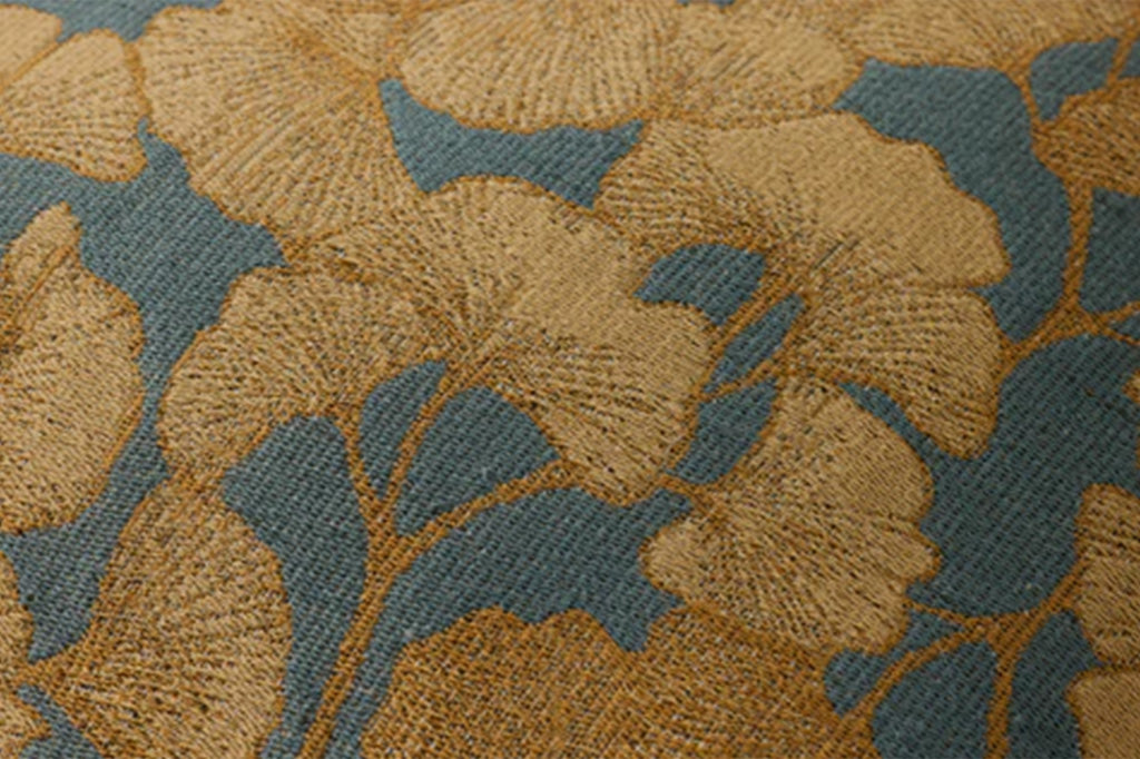 A pillow with ginkgo leaves