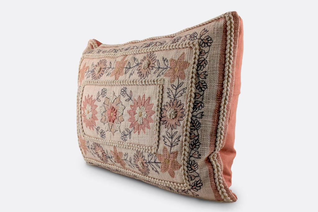embroidered boho style pillow in creams and russet earth tones, rectangular