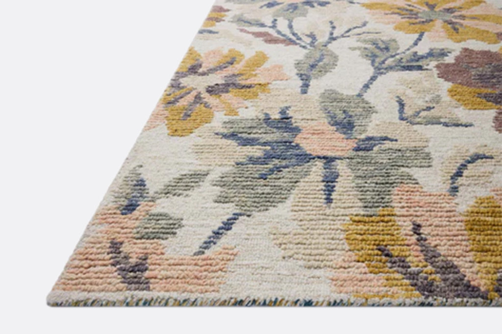Floral patterned rug with multicolor flowers on a white background