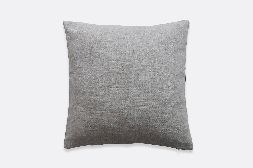 Back view of hidden zipper and solid beige fabric on throw pillow