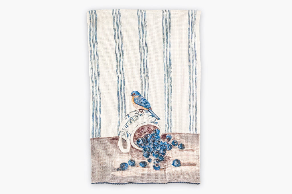 A set of four tea towels with red blue, yellow, and brown stripes. Each Towel features a bird stood upon a pile of assorted fruits.