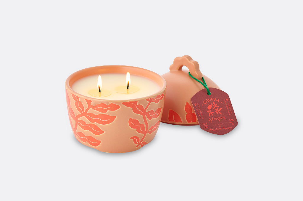 A soft orange guava shaped candle.