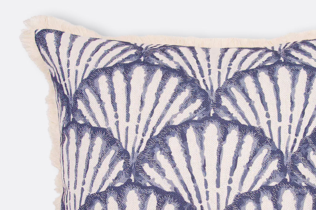 close up of fringe and texture on throw pillow