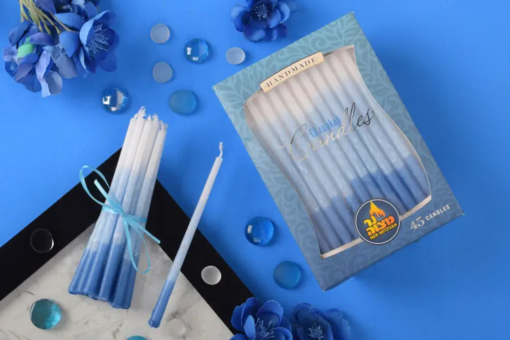 Pack of 45 Hanukah candles, gradient blue to light blue to white candles. 