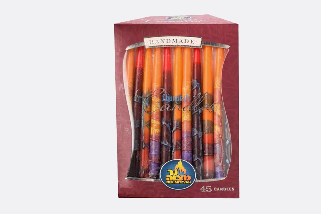 45 Candles for a menorah or Hanukah. Box of multicolored candles white background