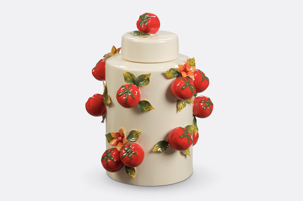 A jar with a tomato design