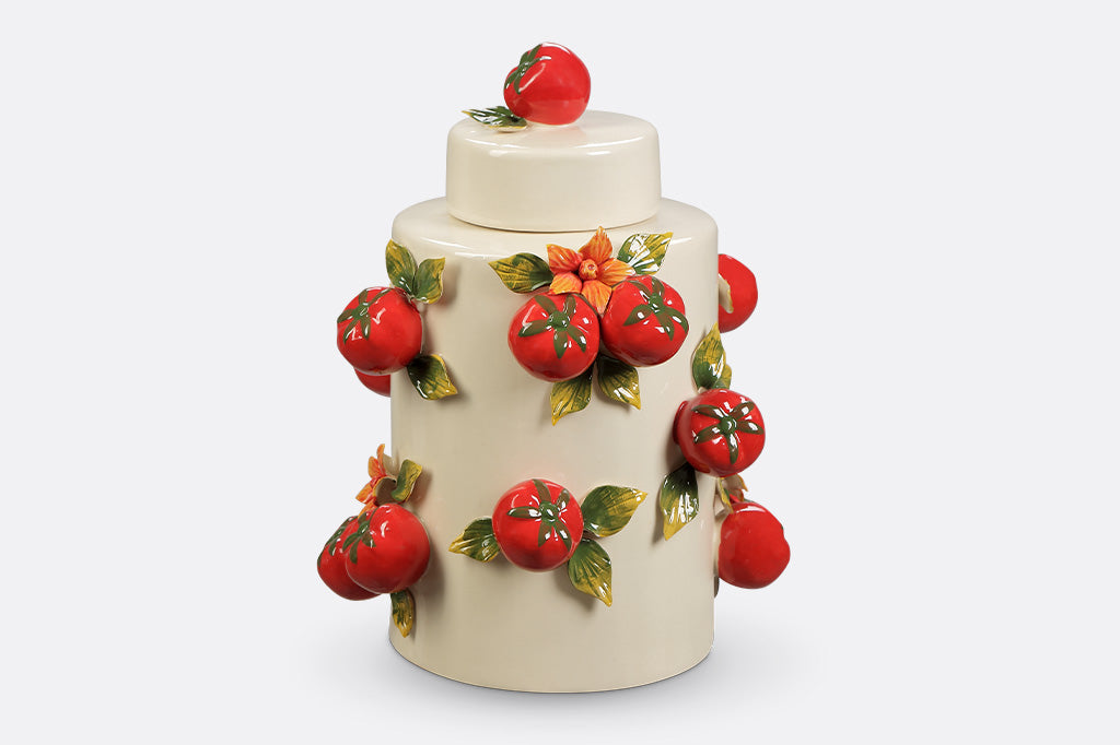A jar with a tomato design