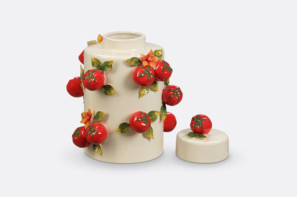 A jar with a tomato design