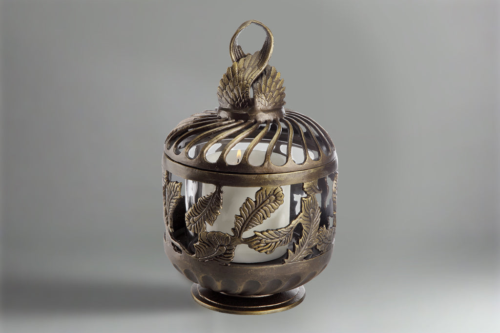 bronze cast metal short lantern with candle inside 
#color_bronze