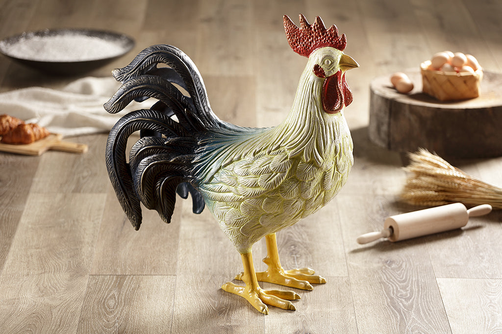 large and colorful cast metal rooster sculpture, all-weather home decor, shown on wood kitchen counter with baking supplies