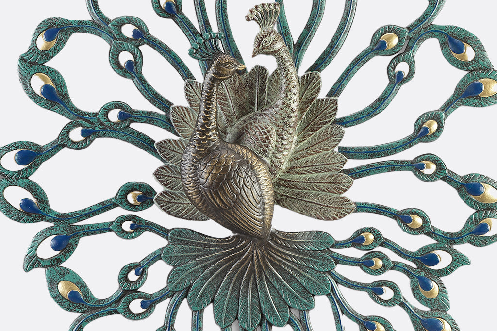large peacock theme cast metal wall art showing two peacocks entertwined in 3D relief
