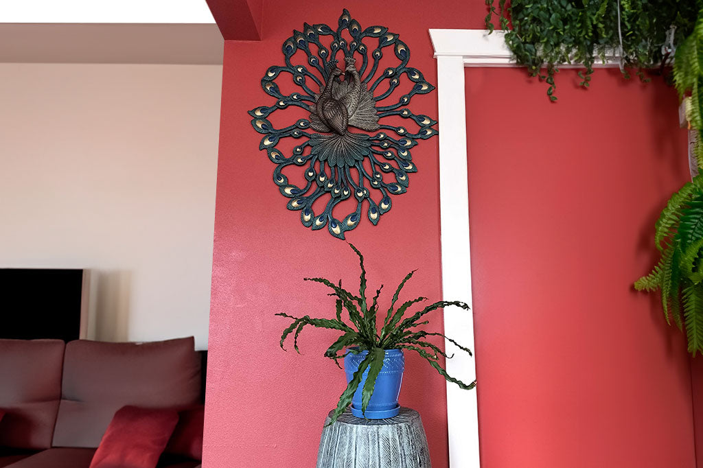 Customer photo of Pas de Deux shown on a narrow red wall above the peacock feather stool; lots of ferns and houseplants hanging from ceilign nearby