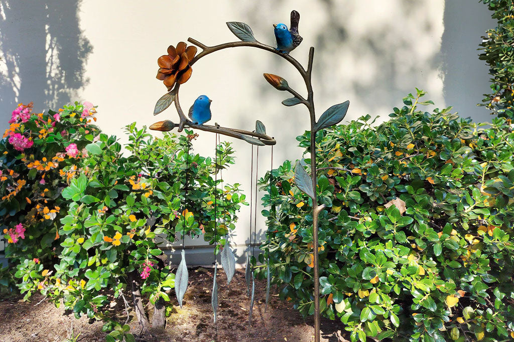 Bluebirds Staked Wind Art in the shade amongst urban landscaping