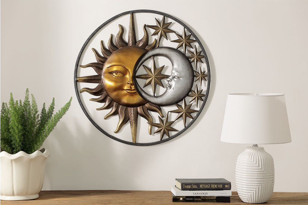 Sun and moon and stars enclosed in circular wall plaque shown on wall above an indoor desk