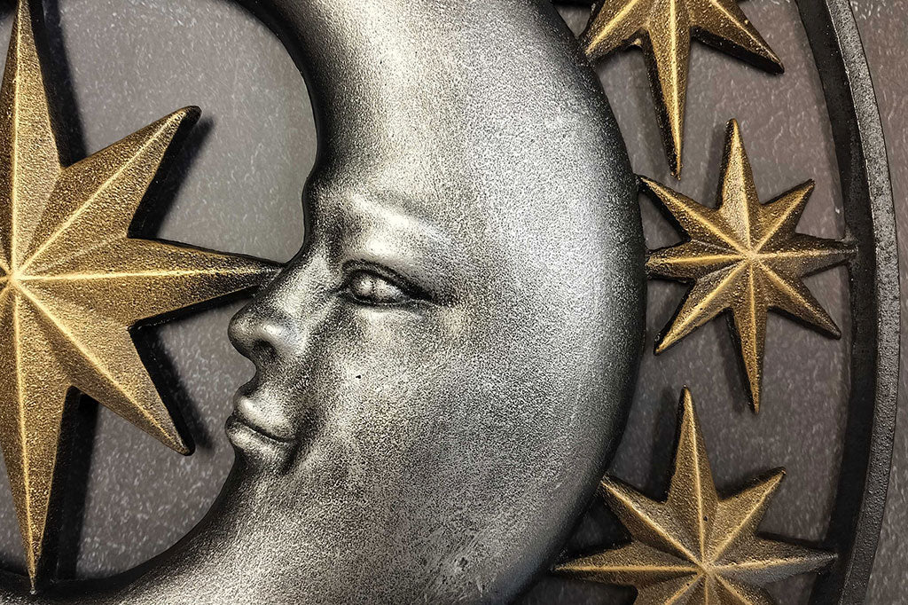 Close up view of the moon and stars relief sculpting on Stellar Skies Wall art