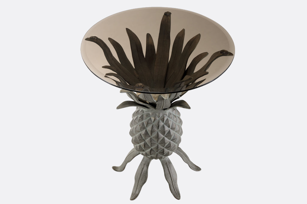Metal pineapple accent table with gray smoked glass top down view