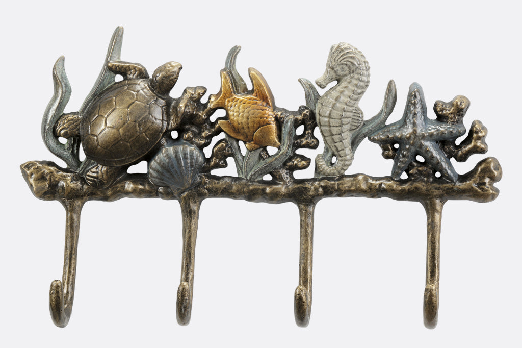 Metal wall hook featuring sea turtle, fish, seahorse, and starfish