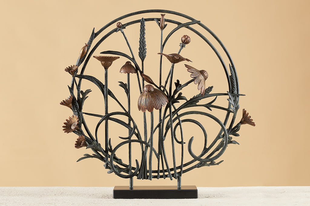 cast metal clover and thistle sculpture