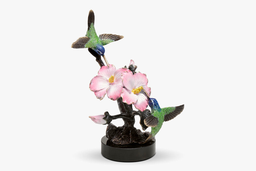 Brass hummingbird sculpture with pink blossoms, indoor sculpture