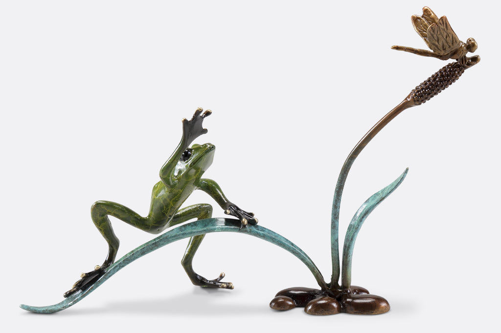 Cast metal frog and dragonfly on cattail sculpture