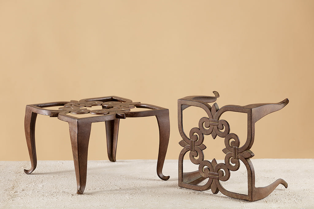 rustic brown finish on classic scrollwork design on pair of plant stands