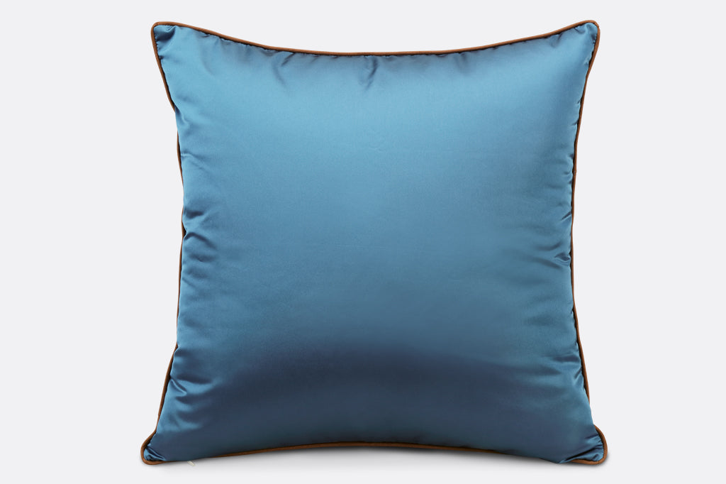 view of back of pillow, plain dark blue satin pillow