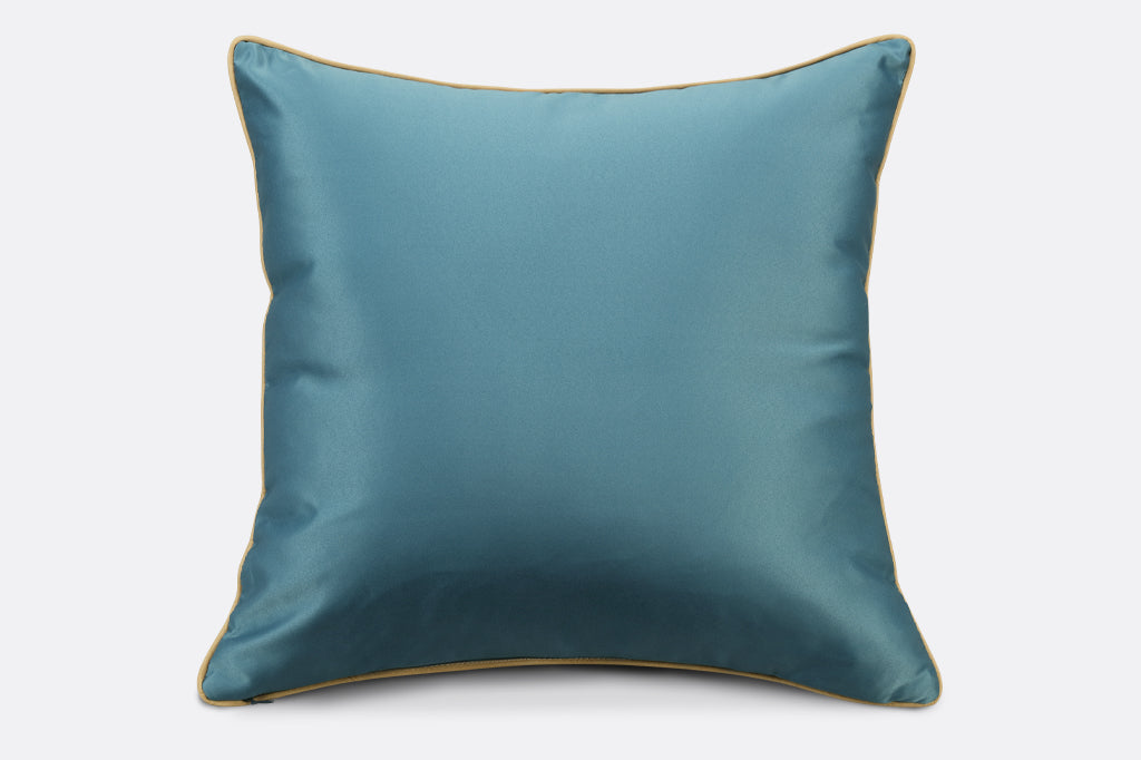 back of blue satin pillows