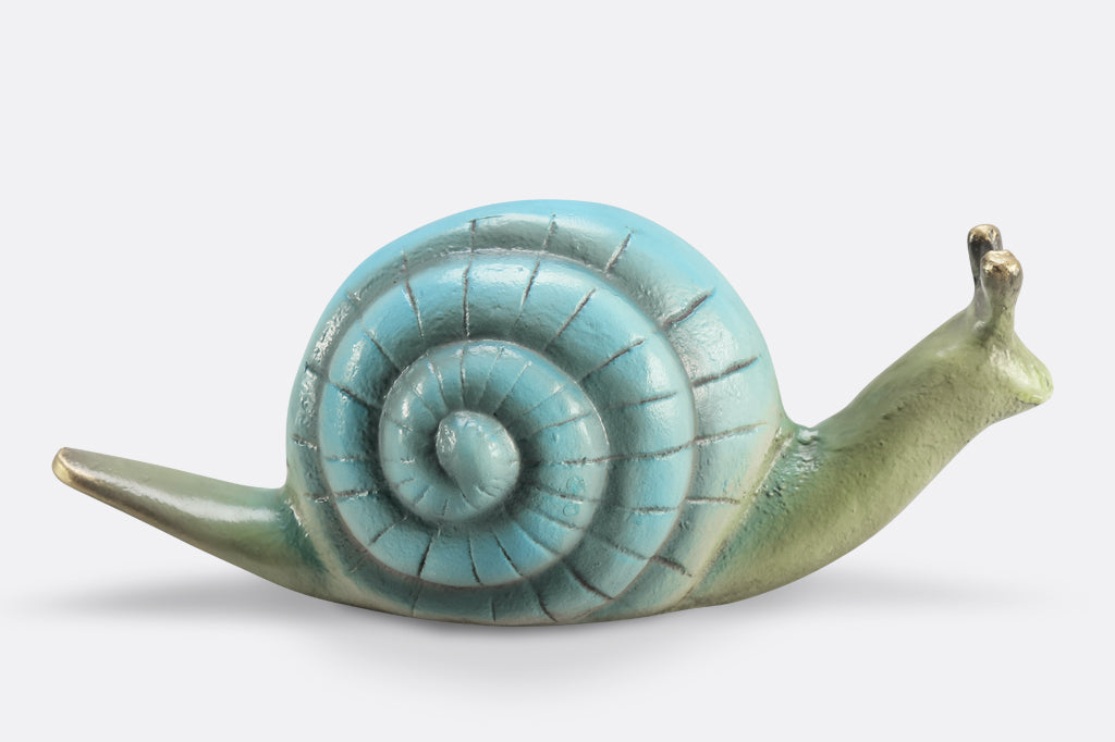 light blue garden snail cast metal sculpture with swirl pattern on shell 