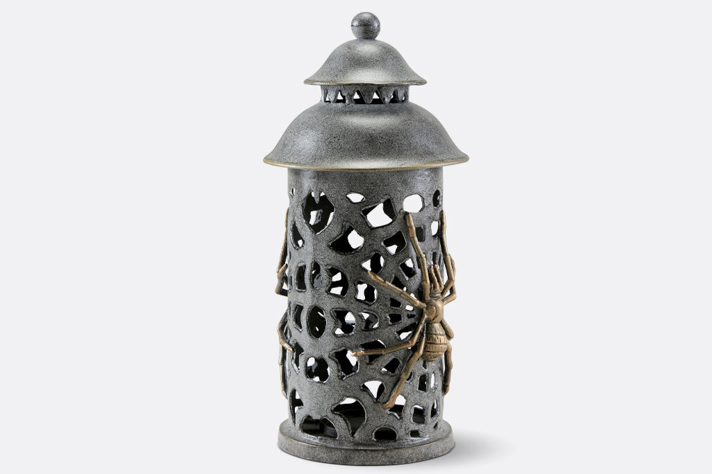 cast metal lantern with two spiders and webbing cut outs 