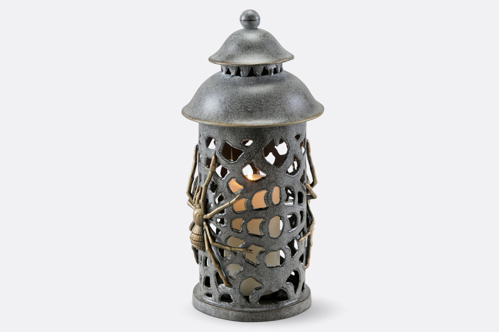 cast metal lantern with two spiders and webbing cut outs 