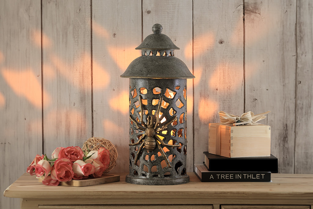 cast metal lantern with two spiders and webbing cut outs 